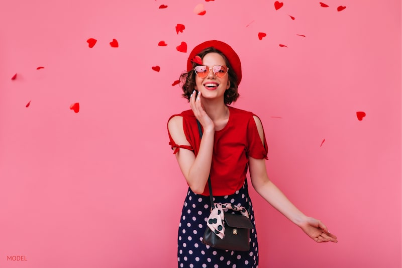 valentines themed woman smiling with clear skin
