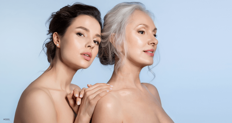 young woman and older woman with bare shoulders and perfect skin.
