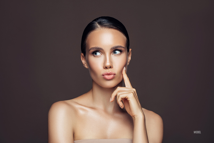 women thinking Which Microneedling Method Should You Choose