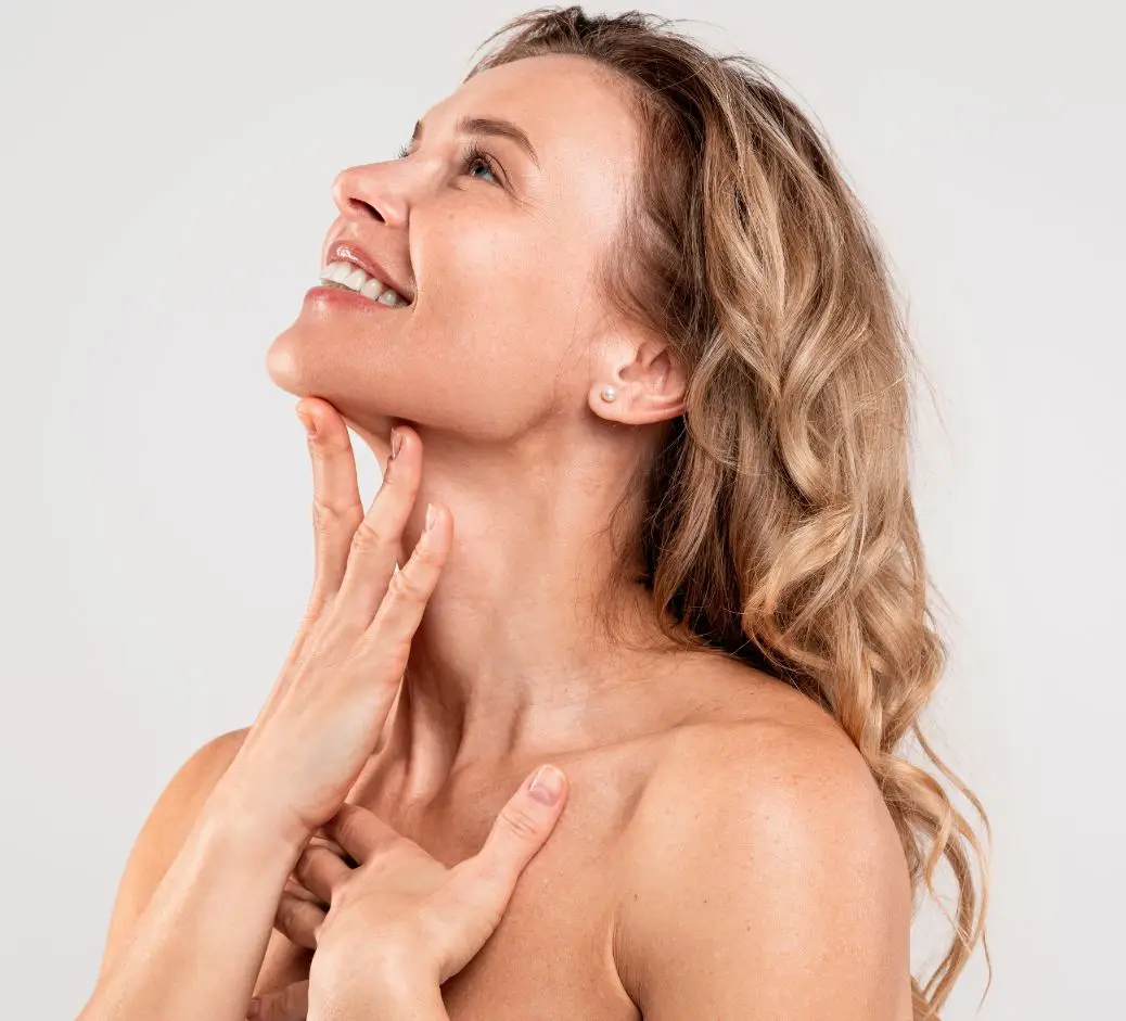 woman touching her neckline