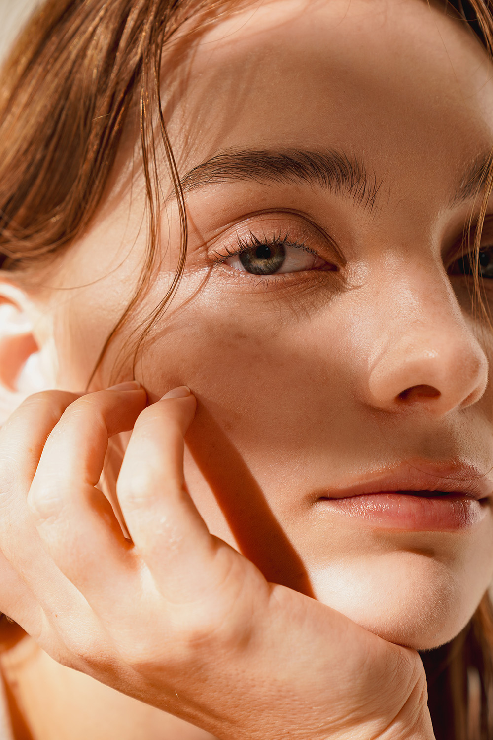 Up close of a womans face in sunlight