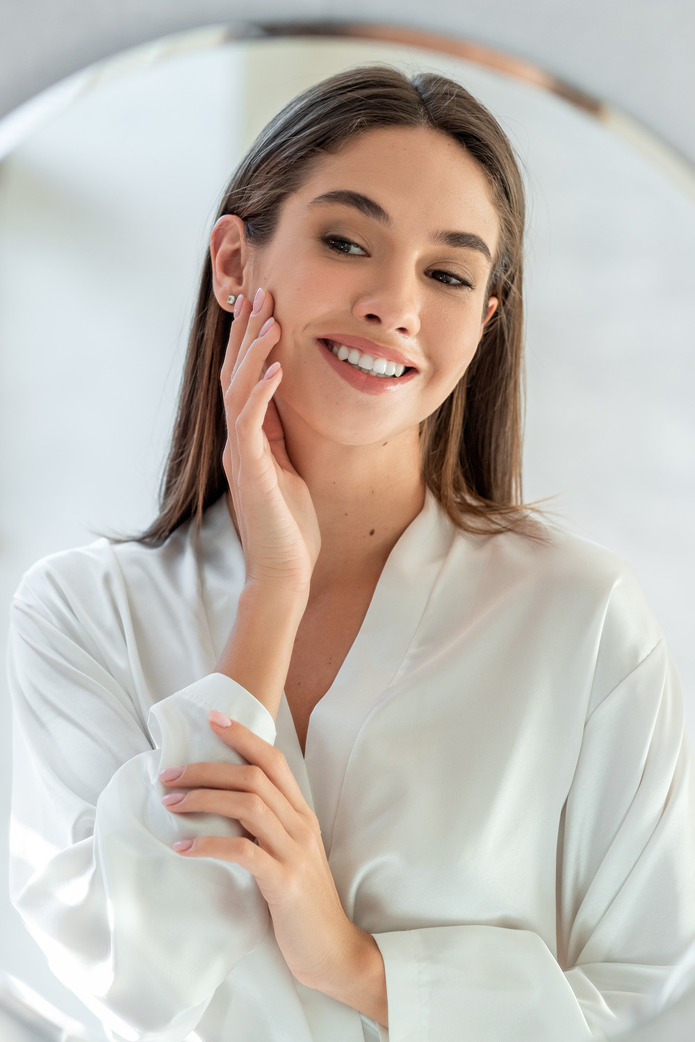 woman looking at herself in the mirror