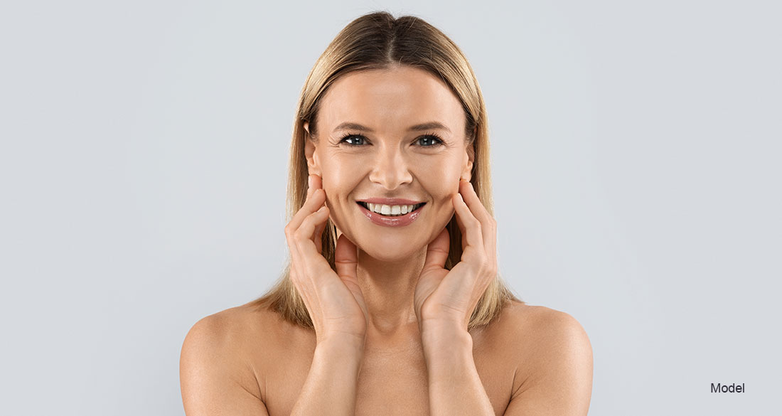 woman touching her face